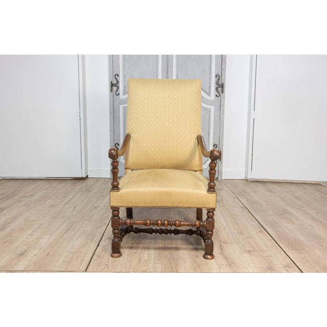 This exquisite 18th-century French Louis XIII-style armchair showcases the timeless craftsmanship and elegance of the...