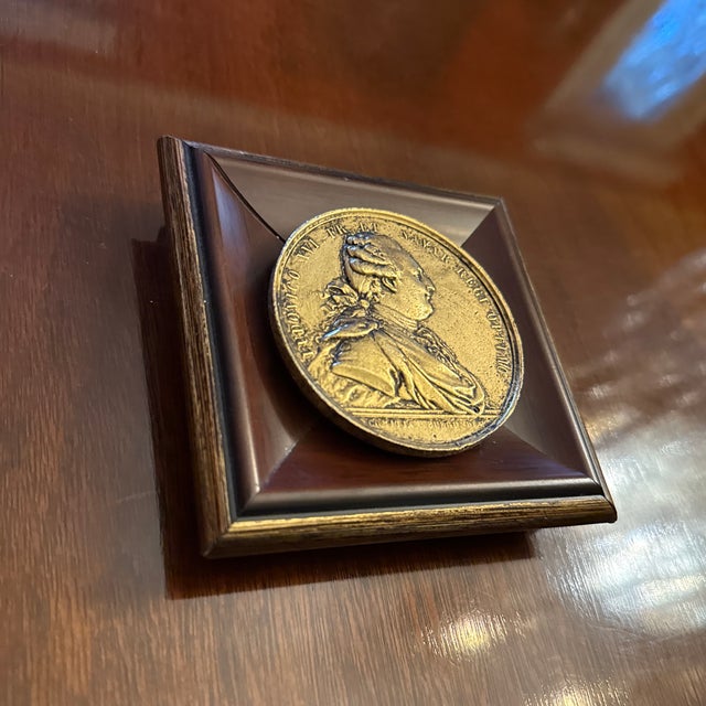 Custom decorative wall object bronze medal plaque with embossed Portrait bust of King Louis XVI mounted onto a wood tone...