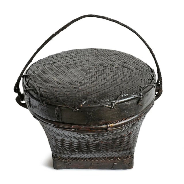 Vintage Akha Thai hand woven basket with lid. Rich dark finish with signs of age and use. Circa mid 20th century.