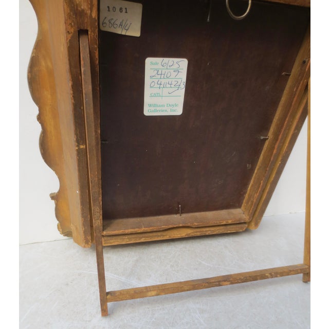 A fine portrait of a gentleman in a curious frame with a back stand to be a tabletop frame or a wall-hung painting....