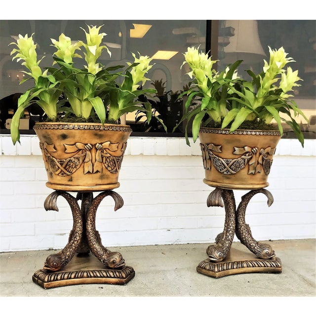 Very pretty pair of planters! These resin planters have three koi fish with uplifted tails creating a pedestal for the...
