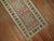 Mid-20th century Turkish runner in predominant soft pink. Narrow and long. Measures: 1'11” x 14'1”.