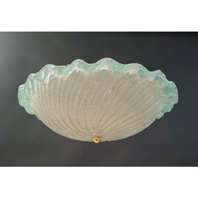 Vintage Italian flush mount or wall light with a clear round Murano glass shade hand blown in Graniglia technique to...