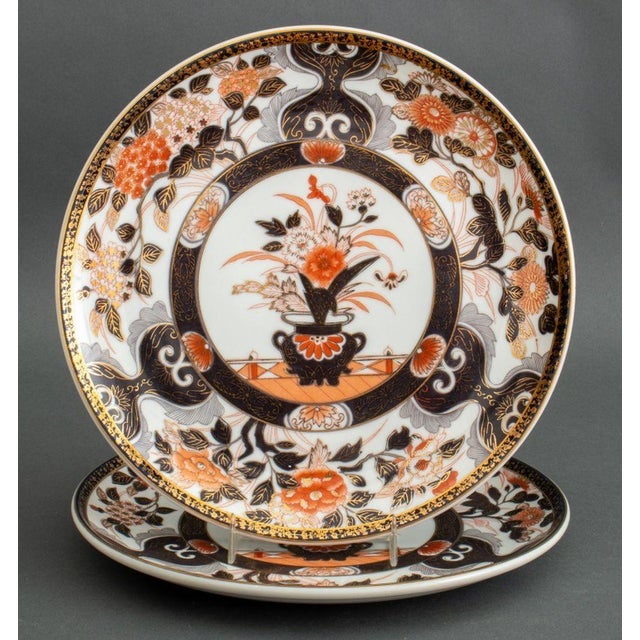 Set of Four Japanese Imari Porcelain Plates, with floral vase motif to center medallion, comprising of: two dinner plates...