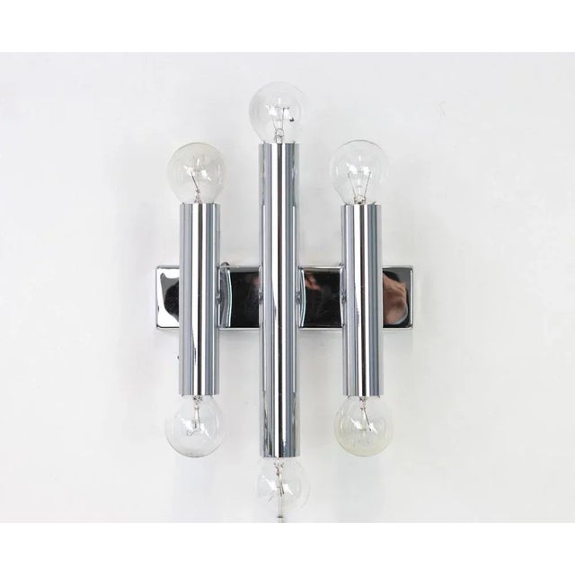 Pair of italian chrome wall sconces sciolari style, 1970s. Each wall light needs 6 x e14 small bulb. Light bulbs are not...