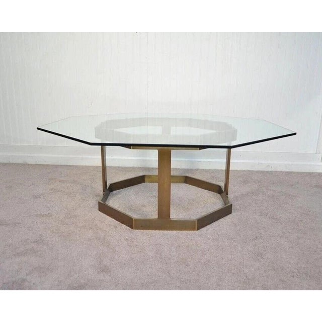 Vintage Mastercraft Hollywood Regency Brass & Octagonal Glass Pedestal Base Coffee Table. Circa Late 20th Century....