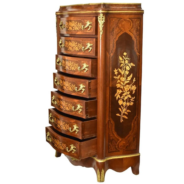 This French Style Mahogany 7 Drawer Chest of Drawers features a classic design with satinwood inlay and brass handles,...