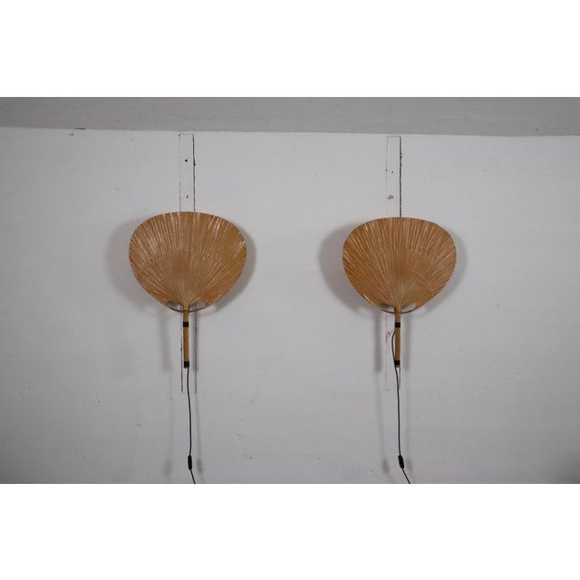 Incredible pair of uchiwa ii wall sconces designed by ingo maurer for m-design, germany 1973. the shades, made of bamboo...