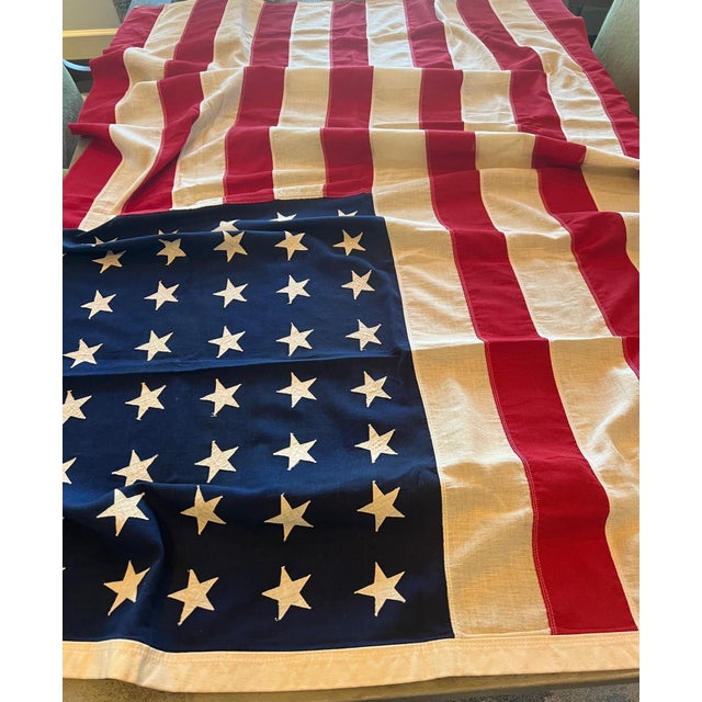 Large WWII-era American flag, 48-star, 46W 68L (approx 4' x 5.5') of heavy, vintage tea-stained color linen with 1"...