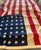 Large WWII-era American flag, 48-star, 46W 68L (approx 4' x 5.5') of heavy, vintage tea-stained color linen with 1"...