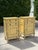 Pair of vintage carved wood nightstands with a warm antique yellow finish and extensive decorative detailing. Each...