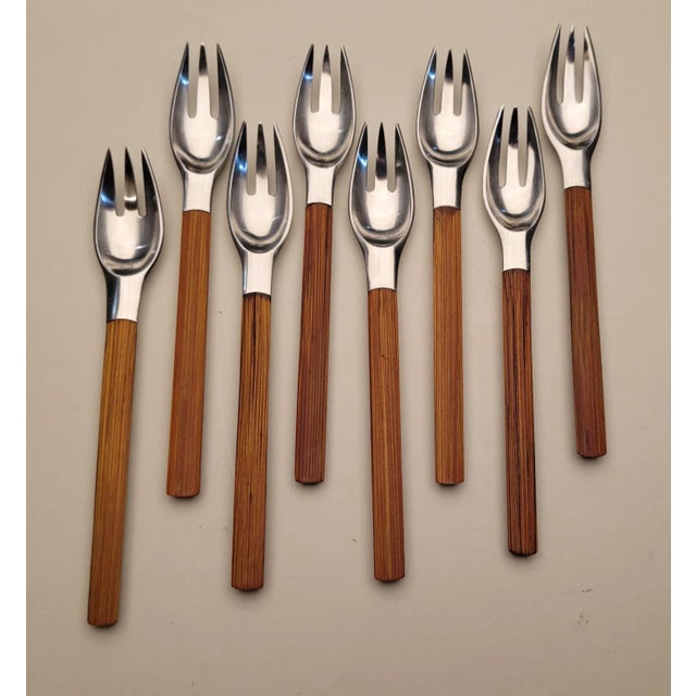 Thirty-eight piece set of Dansk bamboo handled stainless steel flatware. This is the Toke pattern designed by Jens...