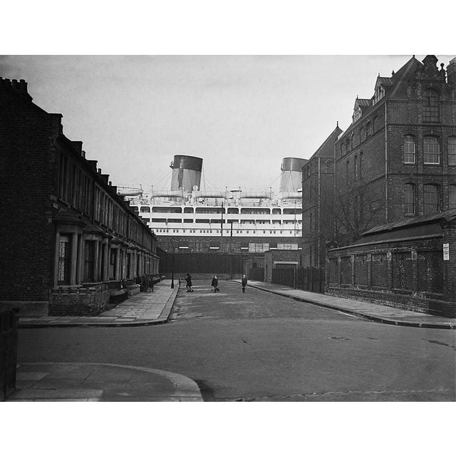 Dominion Monarch The 26,263 ton Shaw Savill liner Dominion Monarch dwarfs the surrounding houses in Saville Road from her...