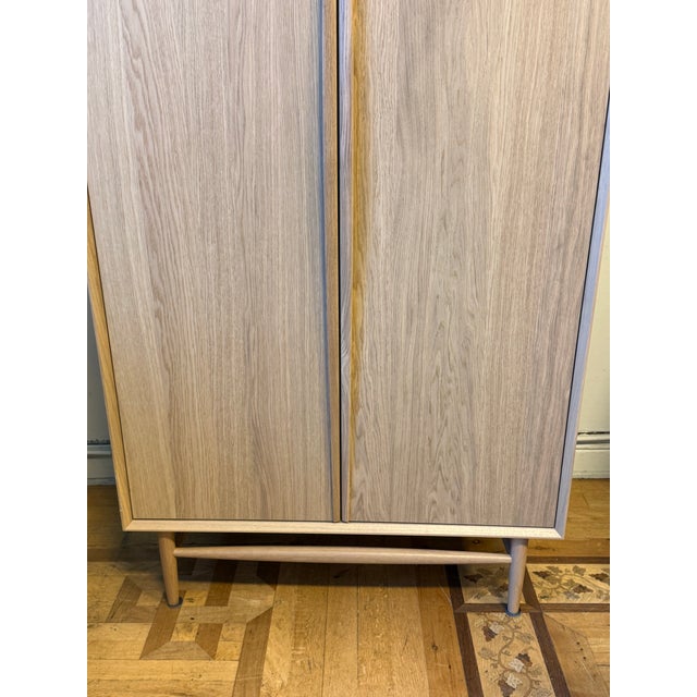 Design Plus Gallery presents the Lenia Armoire from Article. This mid-century modern design showcases a white oak wood...