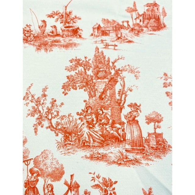 54" wide cotton French country toile upholstery drapery fabric in orange and cream. Price is per yard.