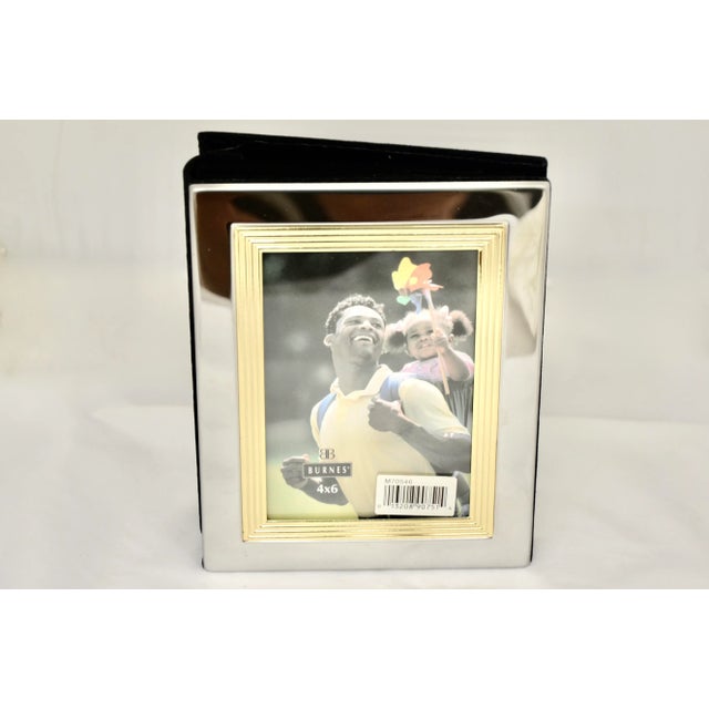 Vintage silver and gold metal keepsake photo album with 40 photo sleeves in the black velveteen interior. Can hold up to...