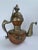 Vintage Tibetan-style copper and brass ceremonial ewer or teapot featuring elaborate hand-worked and applied ornamentation...