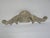 A vintage decorative architectural wall decor scroll. It is made of cement with a gray tone and has a wire on the back for...
