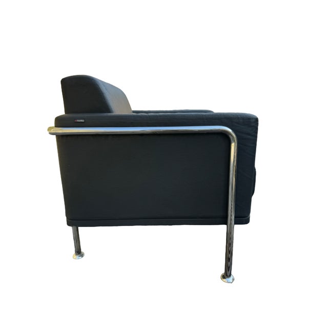 Matis armchair, branded Vaghi. The armchair is made with a chromed metal tubular supporting structure with articulated...