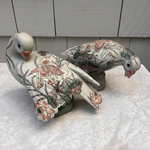 Offering a graceful pair of large dove figurines, circa 1970s. These highly decorative porcelain sculptures are...