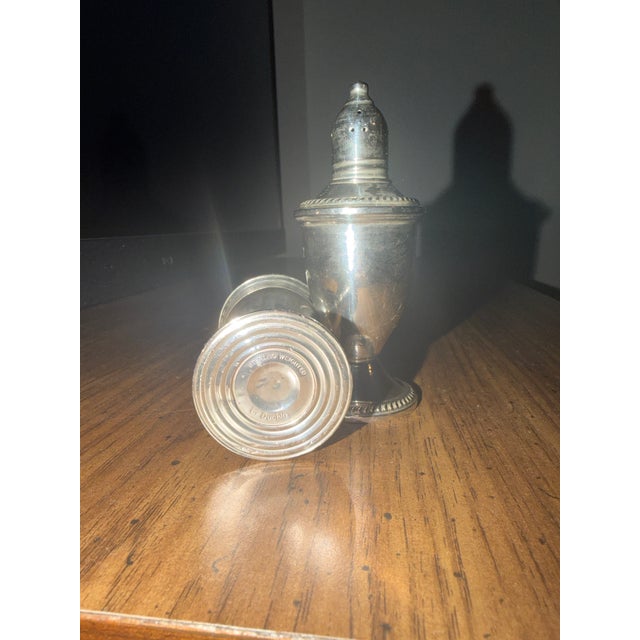 Absolutely beautiful set of Duchin salt and pepper shakers. No scratches., no dents, no discoloration.