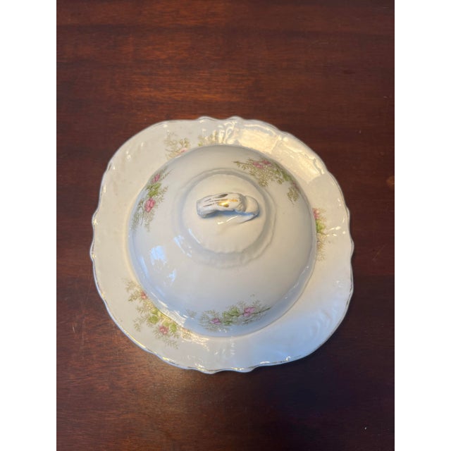 Antique E.P.P.Co. Covered butter dish produced in Ohio in 1890. Has a dome lid with a delicate pink & green floral pattern...