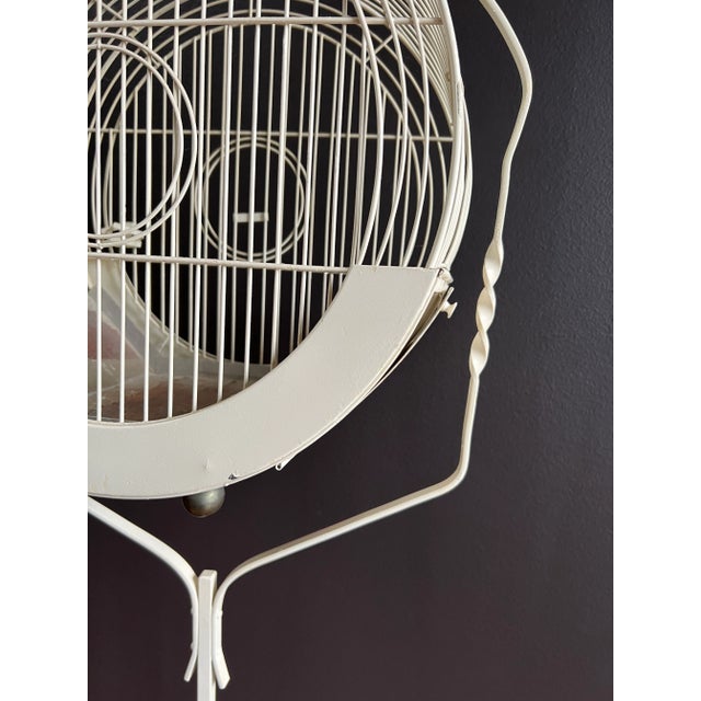 Off white Art Deco bird cage on iron stand. Excellent condition. Beautiful design. Cage dimensions: 15.75" W x 9.75" D x...
