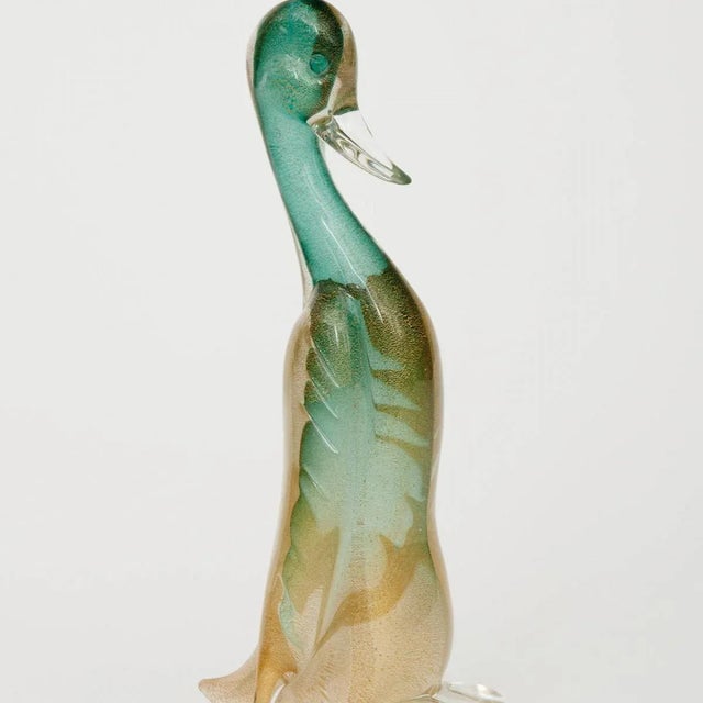 Green Murano glass duck sculpture with inclusive gold flecking.