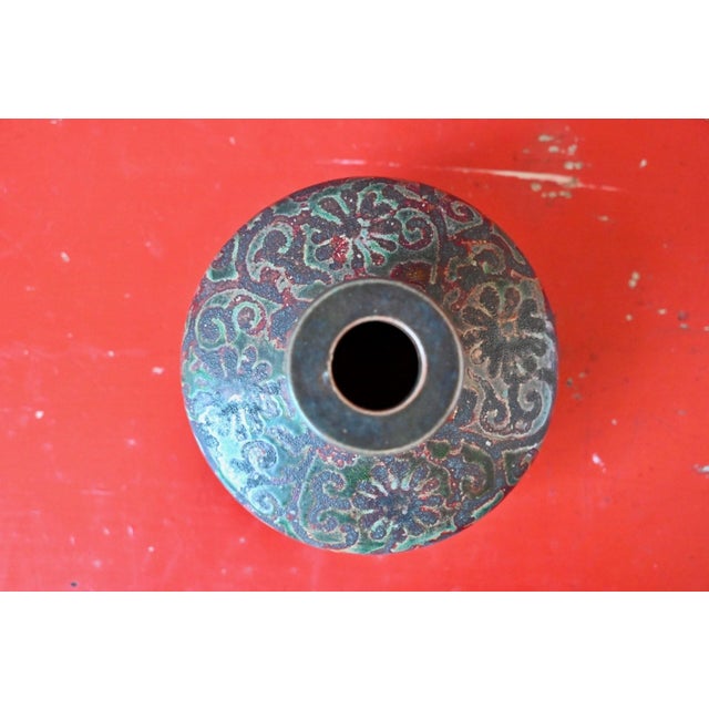 Here is a little treasure that has stood the test of time with a beautiful, quiet grace. This flattened, lenticular vase,...