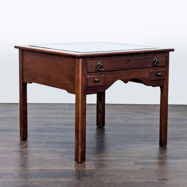 Three drawer, glass top display coffee table with felt lined display area. Brand: Ethan Allen. No maker's label visible....