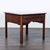 Three drawer, glass top display coffee table with felt lined display area. Brand: Ethan Allen. No maker's label visible....