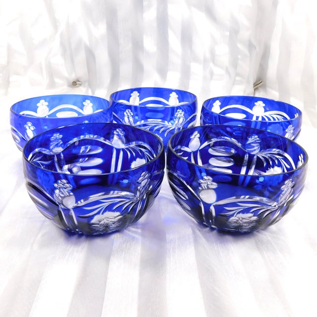 This is a set of five blue matching cut to clear serving bowls. All bowls are the same size, the same cut design and the...