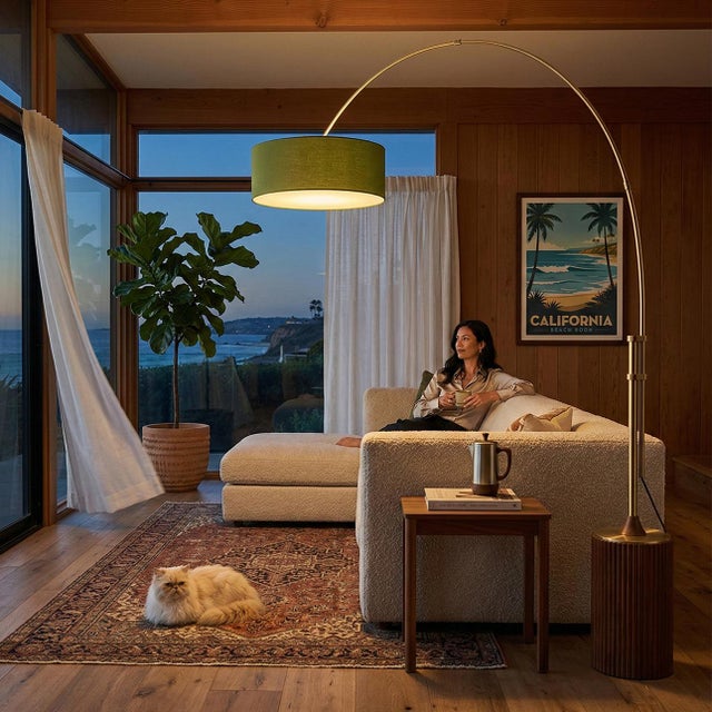 Weathered brass paired with a dark walnut base defines the Tambo Arc Lamp, a mid-century modern masterpiece designed by...