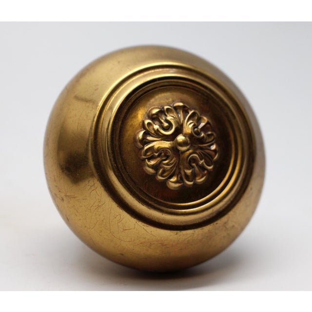 Louis XVI style polished brass doorknob with a concentric design. The manufacturer and date of creation is unknown. The...