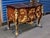 This fine commode is made of real solid wood and parquetry inlays. Has two shaped drawers with the handles forming a...