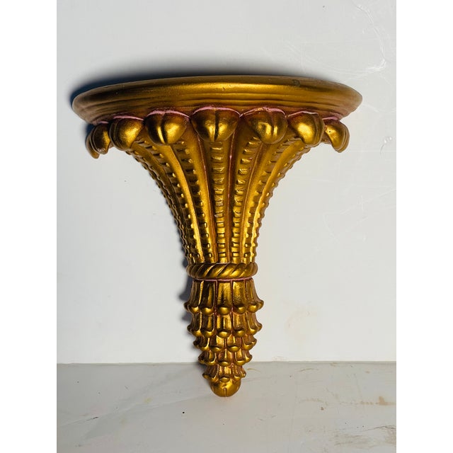 Beautiful gold pain ceramic wall bracket in a shape of achantus.
