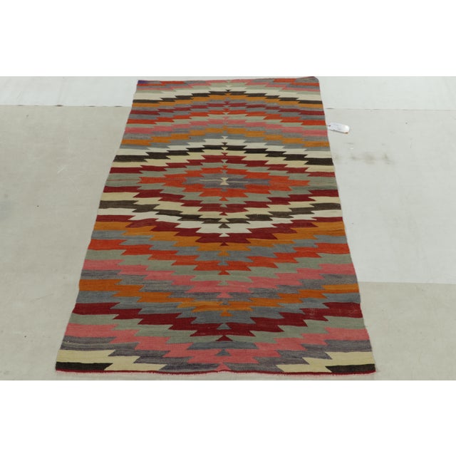 Flat-Woven By Hand In High-Quality Wool Originating From Turkey Between 1940-1950, This Vintage Geometric Kilim Rug Has A...