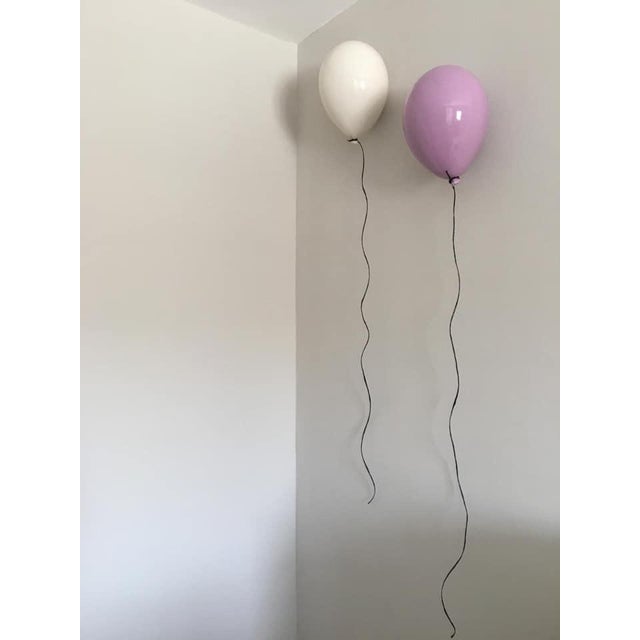 Glossy White balloon sculpture for wall or ceiling installation. Handcrafted from clay by ArtArsouf Clay Luxury Design...
