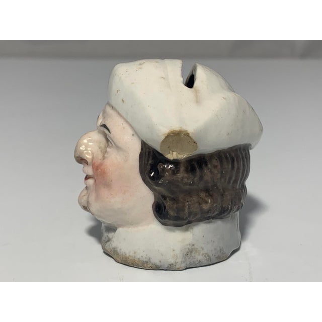 Antique Staffordshire Head Penny Bank for your consideration. The head bank measures approx. 2 inches tall, 2 1/4 inches...