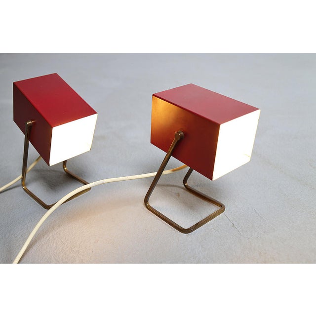 Small, cubist cube lamp made by Kaiser Idell in the 1960s. The model is wine red and has the number 45097. It can be...