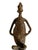 Superb dogon bronze Mali. This bronze is cast over the stone into the form of a seating male holding his belly with...