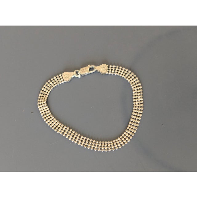 Dainty vintage bracelet with evenly spaced rows of spheres. Vintage 925 silver from Italy with letters FAS, likely the maker.
