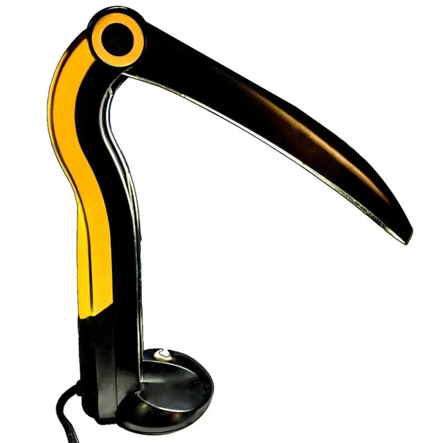 A whimsical and collectible table lamp designed by H.T. Huang for Huangslite in the 1990s. It is fascinating with its...