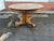 19th Century Regency Style Tiger Oak Round Dining Table With 4 Leaves. The table stands on a tripartite base with hort...