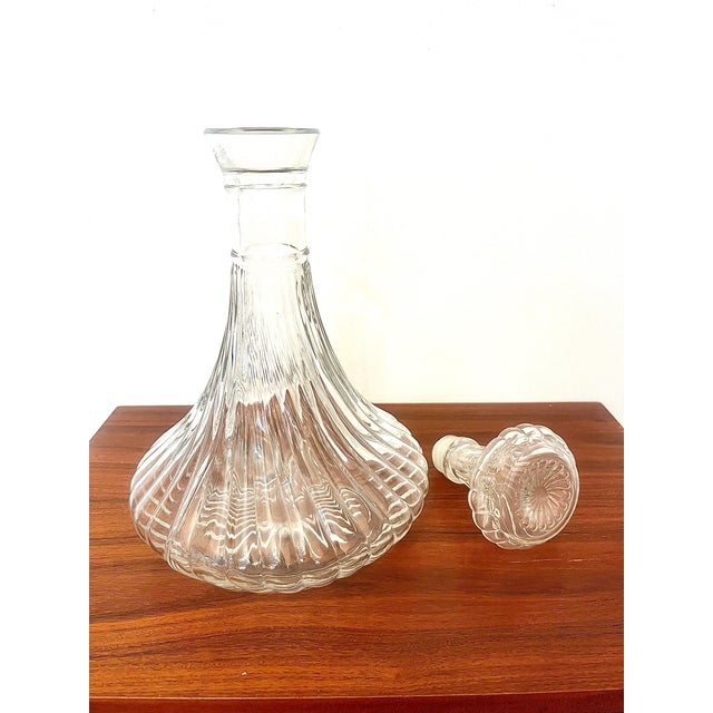 Crystal in motion. A sculptural piece for the art of entertaining. Some pieces don't just find their place on a table:...
