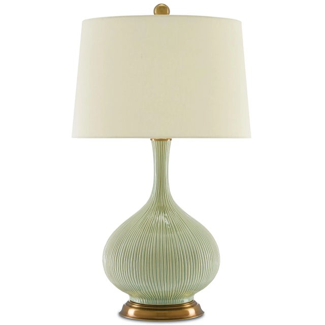 The vase-like body of the Cait Table Lamp is made of striated ceramic in a lovely textural grass green. The paleness of...