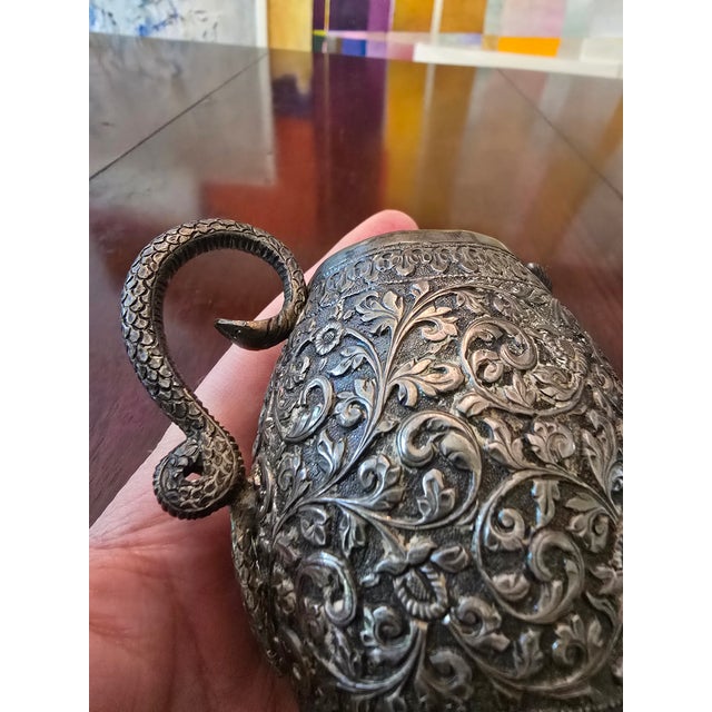 A fine antique hand made silver ( guaranteed over 150 years old silver ) small jug with an applied cobra handle....