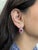 Classic beauty meets refined craftsmanship in these round Madagascar ruby earrings, totaling 5.6 carats. Surrounded by...