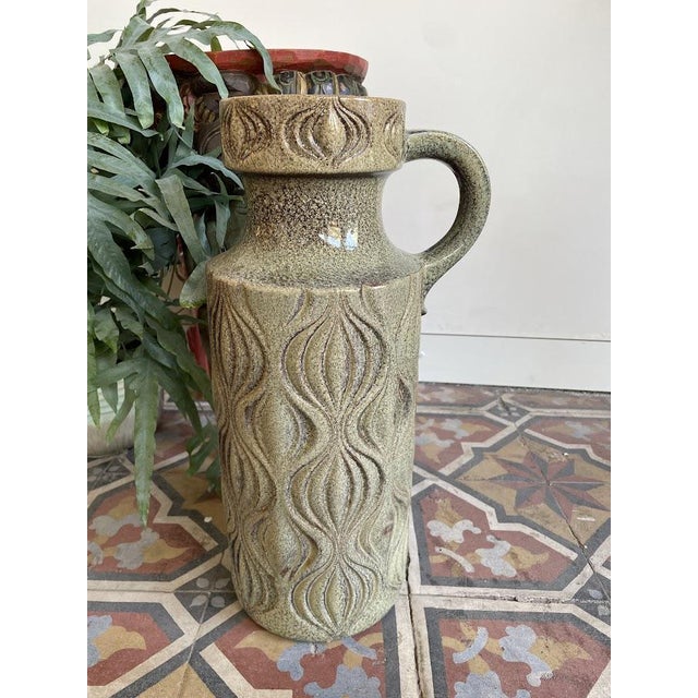 Large West German vase with a playful relief and earthy colors. It is also referred to as an 'onion vase' due to its...