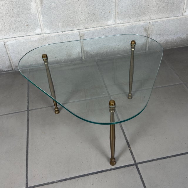A coffee table attributed to the Fontana Arte workshop from the 20th century, an icon of Italian design with a minimalist...